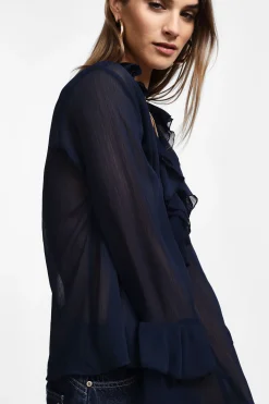 Camisa con mangas largas y volantes