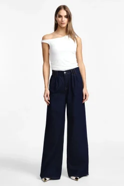 Jeans a gamba larga con vita alta e pinces