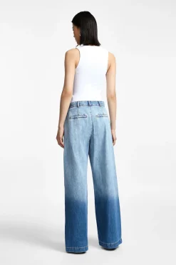 Jeans a gamba larga con vita media sfumati