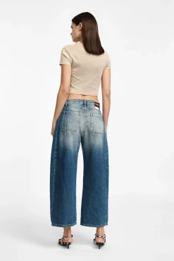 Jeans a gamba larga tapered con vita media