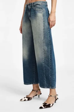 Jeans a gamba larga tapered con vita media