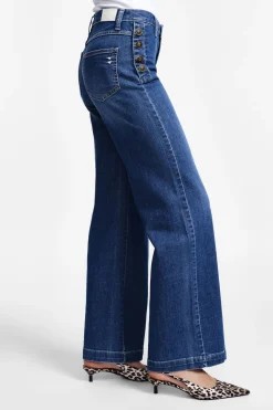 Jeans a zampa con bottoni laterali
