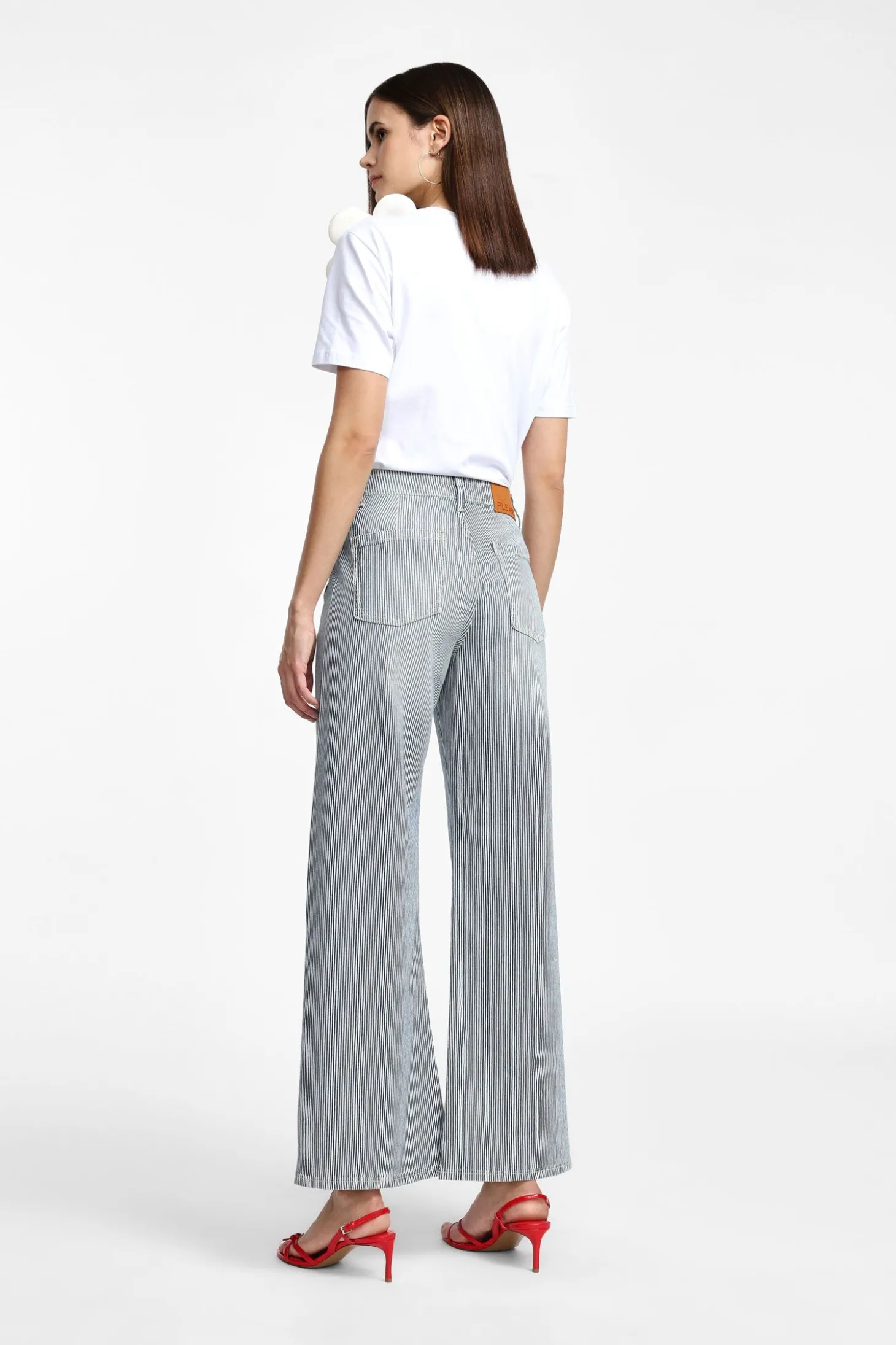 Jeans a zampa con righe e tasche