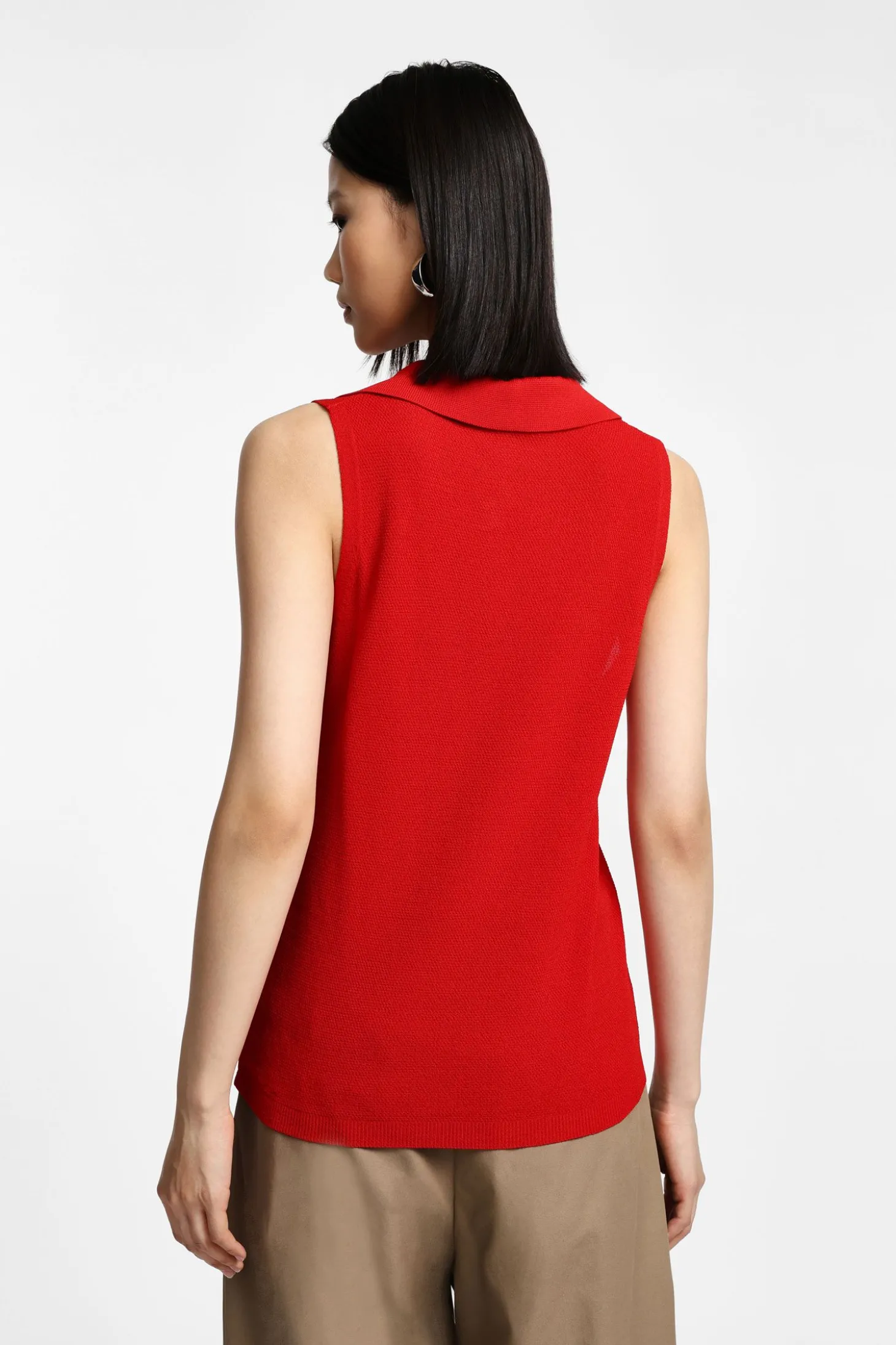 Top de punto sin mangas con cuello polo