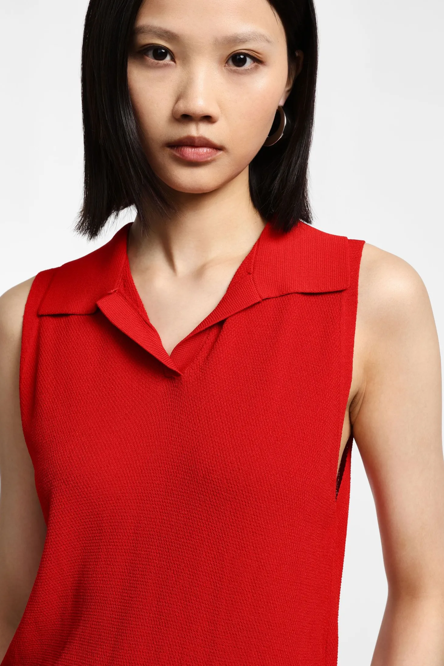 Top de punto sin mangas con cuello polo